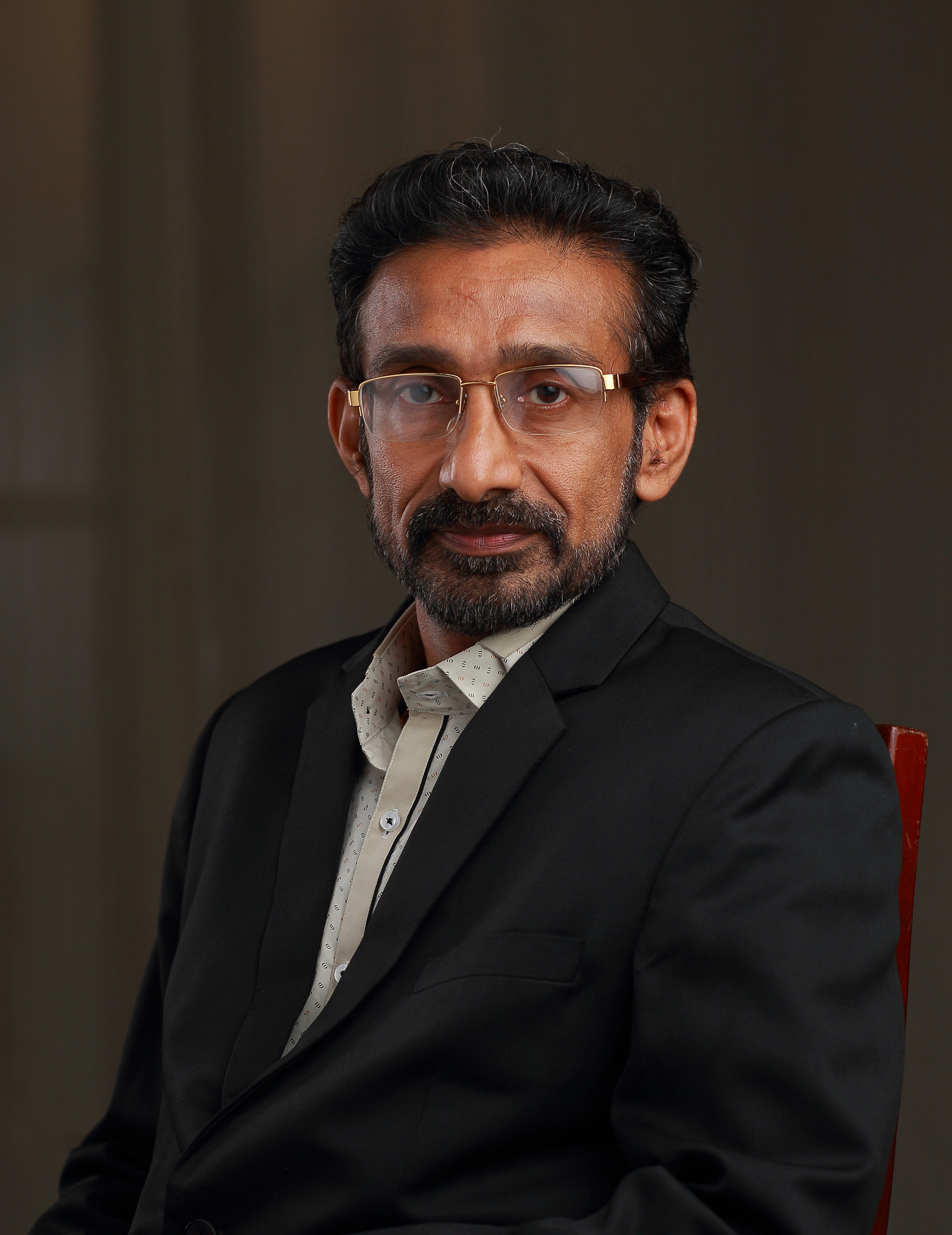 Dr. AJIT BHASKAR